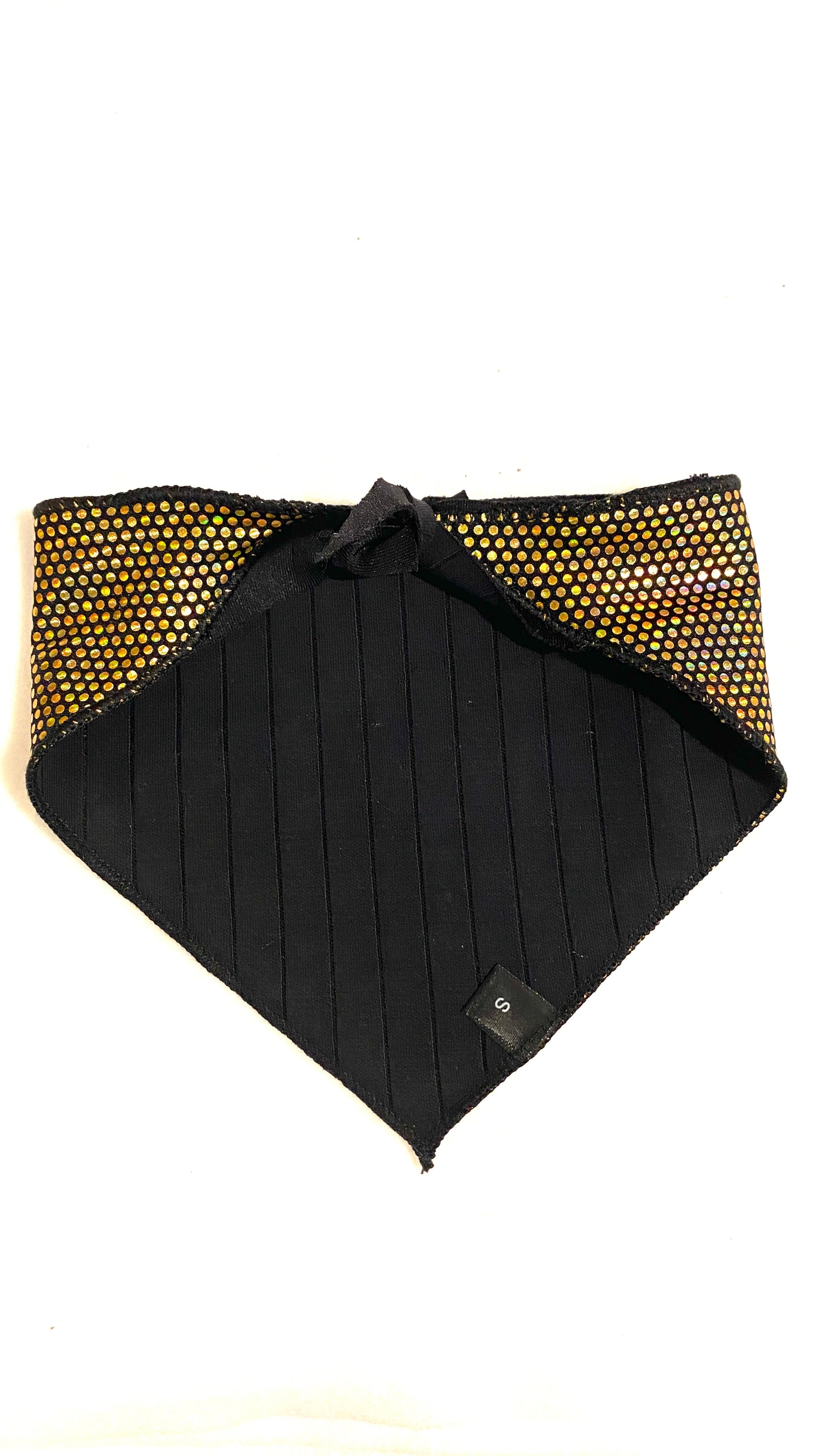 Black and gold patterned dog bandana on a white background