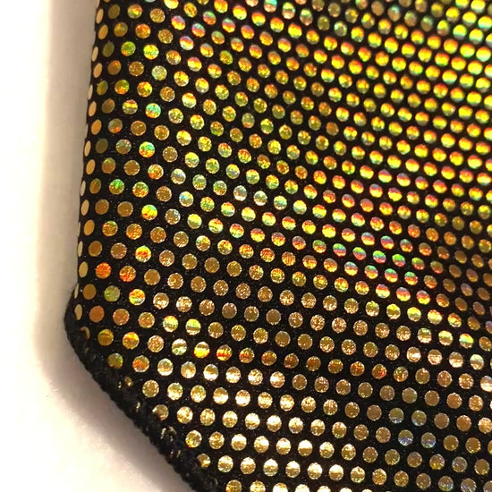 Gold dot iridescent dog bandana with black lining.