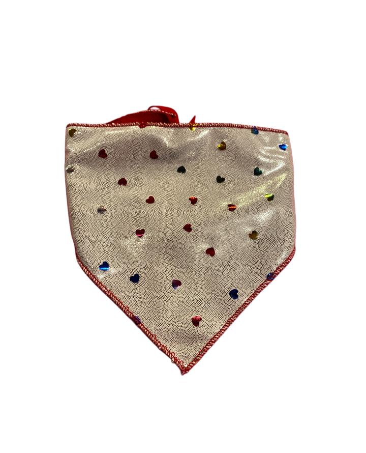 Silver dog bandana with rainbow hearts and red trim.